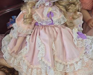 Victorian-style Porcelain Doll with Elaborate Gown and Bonnet