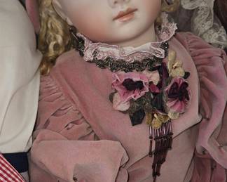 Victorian-style Porcelain Doll in Pink Velvet Gown