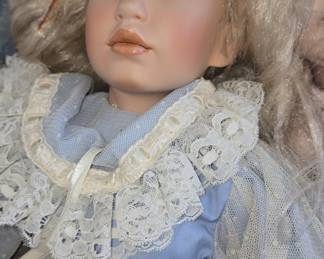 Porcelain Doll with Blonde Hair and Blue Dress