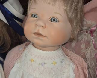 Porcelain Doll with Blonde Hair and Blue Eyes