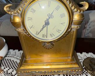 Ornate Gilt Mantel Clock with Roman Numerals and Shell Motif