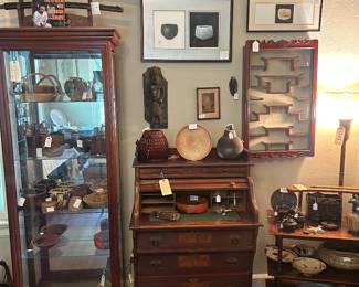 Tall Lighted Curio Display Cabinet with adjustable glass shelves, Antique Renaissance Revival Walnut Desk with Tambour Door and Pull out Writing Area, 3 Tier Mahogany open display on Casters, Censers, Incense Burners, Antique Japanese Armrest, American Studio Pottery  including Harding Black on lower tier, 