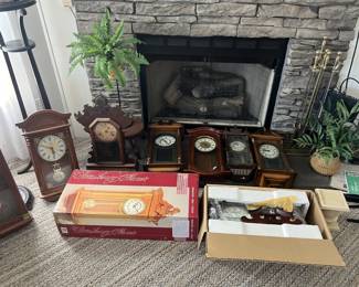 This image is a continuation of the previous, and includes eight more grandfather clocks.