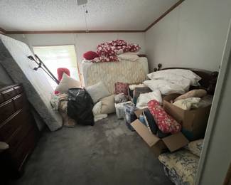 This room is filled with a variety of pillows, linens, quilts and more!