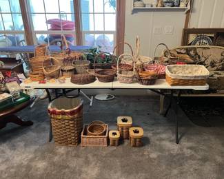 A table covered in wicker baskets of varying sizes and shapes.