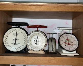 A collection of vintage kitchen scales.