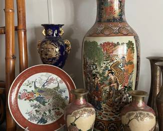 A collection of intricately decorated china and vases.