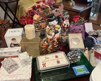 A table full of a variety of holiday items and decor. Mostly Christmas, but some items for Halloween and Thanksgiving as well.