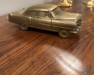 Small brass Cadillac-style car model