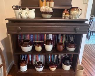 A converted pie safe, various stoneware crocks, pots and pitchers