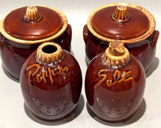 Hull stoneware crocks and a set of salt and pepper shakers