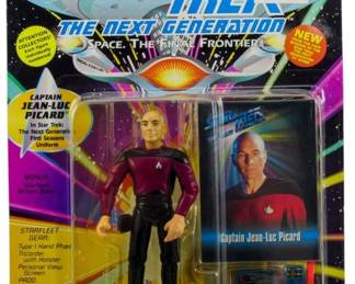 537 - Playmates Star Trek TNG Picard Figure (Description): Unopened Playmates Star Trek The Next Generation action figure in original packaging featuring Captain Jean-Luc Picard. The figure remains sealed in its box, preserving its collectible condition.