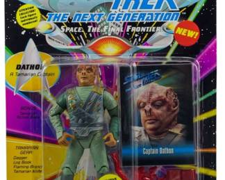 551 - Playmates Star Trek TNG Dathon Figure in Box (Description): Unopened Playmates Star Trek The Next Generation action figure of Dathon, a Tamarian Captain. The figure remains sealed in its original packaging and includes bonus Tamarian action base, Tamarian gear consisting of a dagger, log book, flaming branch,