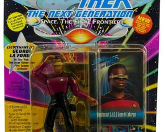 536 - Playmates Star Trek TNG Lt Geordi La Forge (Description): Unopened Playmates Star Trek The Next Generation action figure in original box featuring Lieutenant Geordi La Forge. The figure remains factory sealed in its original packaging.