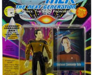 544 - Playmates Star Trek TNG Lt Commander Data (Description): Unopened Playmates Star Trek The Next Generation action figure in original box featuring Lieutenant Commander Data. The figure remains factory sealed in its original packaging.