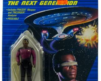 557 - Galoob Star Trek TNG Geordi LaForge Figure (Description): Unopened Galoob Star Trek: The Next Generation action figure in original box featuring Lieutenant Geordi LaForge. The figure remains factory sealed in its original packaging.
