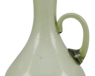 568 - Blenko Smoke Glass Pitcher Vase 5.5" (Description): Mid-century modern smoke glass pitcher vase featuring an elegant elongated neck with an angular spout and applied loop handle. The piece has a bulbous base that tapers gracefully into a slender neck, showcasing the characteristic smoky olive-green tint popular in mid-century glassware. Measures 5.5 inches tall.