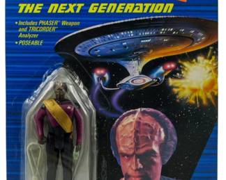 556 - Galoob Star Trek TNG Lt. Worf Figure in Box (Description): Unopened Galoob Star Trek The Next Generation action figure in original box featuring Lieutenant Worf. The figure remains sealed in its original packaging.