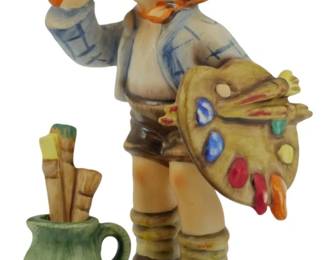569 - The Artist Hummel Figure 5.5" (Description): The Artist Hummel figurine depicting a young boy holding a painter's palette and brush. The charming figure shows the child in a blue and white shirt with an orange neckerchief, brown shorts, and knee socks. A green pitcher filled with paintbrushes sits at his feet. Measures 5.5 inches tall.