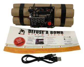 5717 - Defuse A Bomb Alarm Clock - 9 x 4 (Description): Used as is electric/electronic/mechanical item. No guarantee all components, untested.