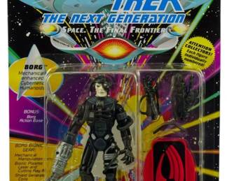 522 - Star Trek Next Generation Borg Figure Sealed (Description): Unopened Star Trek The Next Generation action figure in original packaging. This Borg figure is manufactured by Playmates and remains factory sealed. The packaging features the iconic Star Trek: The Next Generation branding with 'Space, The Final Fro