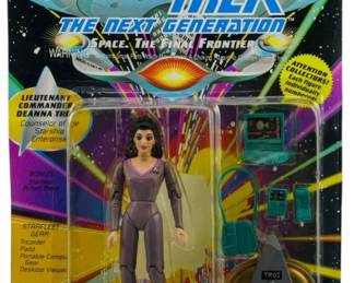538 - Playmates Star Trek TNG Deanna Troi Figure (Description): Unopened Playmates Star Trek The Next Generation figure in original packaging featuring Lieutenant Commander Deanna Troi, Counselor of the Starship Enterprise. The figure includes Starfleet gear accessories including tricorder, padd, portable compute