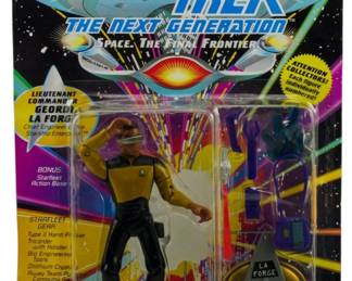 548 - Playmates Star Trek TNG Geordi La Forge (Description): Unopened Playmates Star Trek The Next Generation action figure in original packaging. This figure depicts Lieutenant Commander Geordi La Forge, Chief Engineer of the Starship Enterprise. The figure remains sealed in its original box and includes bonu