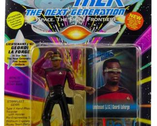 543 - Playmates Star Trek TNG Lt Geordi La Forge (Description): Unopened Playmates Star Trek The Next Generation action figure in original box featuring Lieutenant Geordi La Forge. The figure remains factory sealed in its original packaging.