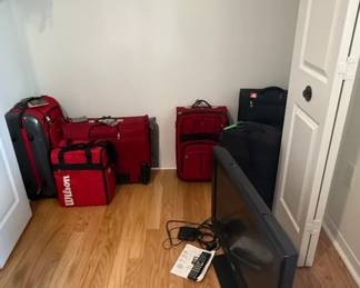 Assorted Luggage and Television Set