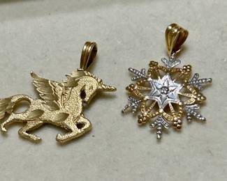 gold unicorn and snowflake pendants