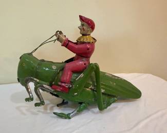 Antique Clown on a Grasshopper Tin Type Toy