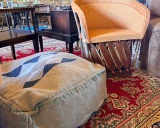 Mexican Equipal barrel chair and a bohemian woven floor pouf ottoman