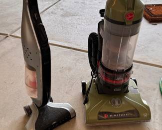 pair of Hoover vacuums