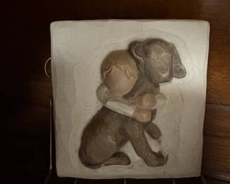 . . . Willow Tree boy hugging dog