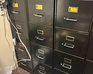 . . . three four-drawer file cabinets