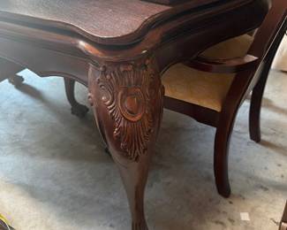 Dining room table with protective pad 