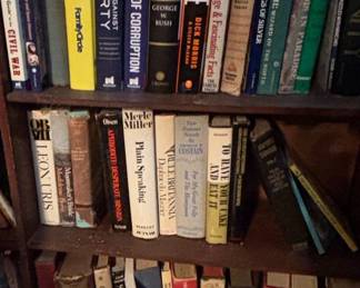 Assorted Collection of Books on a Wooden Bookshelf