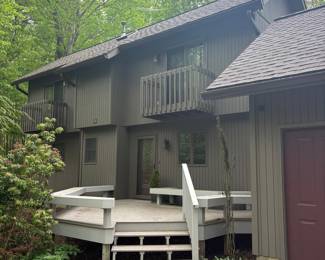 Modern Wood-Sided House with Deck and Balcony
