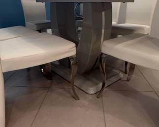 White Faux Leather Dining Chairs with MarbleEffect Pedestal Table
