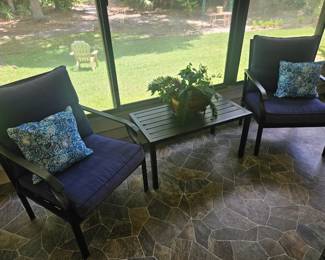 Here is one view of the four piece metal patio set with light new cushions includes two chairs a table and a love seat $150