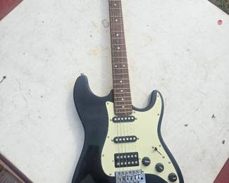 I believe this guitar was bought in a storage unit I cannot find any markings on it next photo is the reverse side