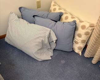 Assorted Decorative Throw Pillows with Gingham and Abstract Patterns