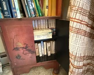 Asian inspired tall, narrow bookcase.