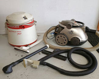 Lot 74: Vacuum cleaners with hoses and attachments