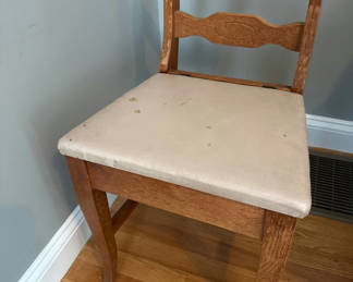 Lot 19: Distressed wooden chair with upholstered leather seat