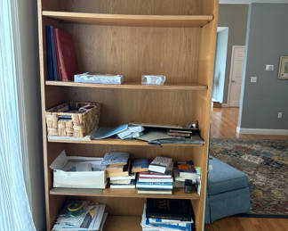 Lot 21: Wooden bookshelf with books and papers