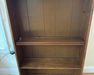 Lot 23: Tall wooden bookcase with shelves