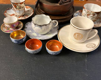 Lot 75: Assorted porcelain teacups, saucers, and small bowls