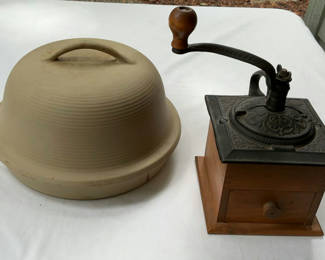 Lot 67: Antique hand-crank coffee grinder and beige ceramic cloche with base
