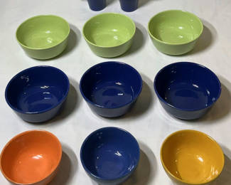 Lot 17: Colorful ceramic bowls with two blue mugs